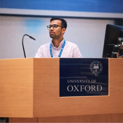 Aman Pawar presenting at the University of Oxford